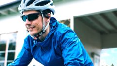 Man enjoying Nearphones on a bicycle