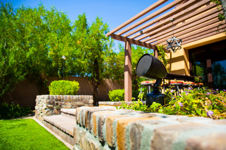 SoundTube's Cherry Bomb 3-way speaker installed in a backyard